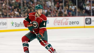 Feb 28, 2016; Saint Paul, MN, USA; Minnesota Wild forward Mike Reilly (4) passes in the second period against the Florida Panthers at Xcel Energy Center. The Minnesota Wild beat the Florida Panthers 3-1. Mandatory Credit: Brad Rempel-USA TODAY Sports
