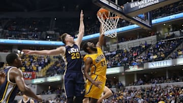 Nov 10, 2014; Indianapolis, IN, USA; Indiana Pacers forward Solomon Hill (44) dunks against Utah Jazz forward Gordon Hayward (20) at Bankers Life Fieldhouse. Indiana defeats Utah 97-86. Mandatory Credit: Brian Spurlock-USA TODAY Sports
