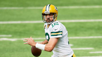 MINNEAPOLIS, MINNESOTA - SEPTEMBER 13: Quarterback Aaron Rodgers #12 of the Green Bay Packers scrambles with the ball against the Minnesota Vikings during the game at U.S. Bank Stadium on September 13, 2020 in Minneapolis, Minnesota. The Packers defeated the Vikings 43-34. (Photo by Hannah Foslien/Getty Images)