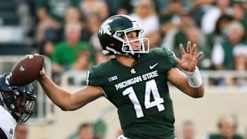 EAST LANSING, MI - AUGUST 31: Michigan State Spartans quarterback Brian Lewerke (14) unloads a pass during a non-conference college football game between Michigan State and Utah State on August 31, 2018, at Spartan Stadium in East Lansing, MI.(Photo by Adam Ruff/Icon Sportswire via Getty Images)