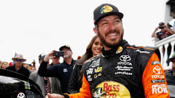 LONG POND, PA - JUNE 03: Martin Truex Jr., driver of the #78 Bass Pro Shops/5-hour ENERGY Toyota, celebrates in Victory Lane after winning the Monster Energy NASCAR Cup Series Pocono 400 at Pocono Raceway on June 3, 2018 in Long Pond, Pennsylvania. (Photo by Jeff Zelevansky/Getty Images)