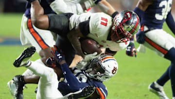 Auburn football cornerback Nehemiah Pritchett (18) stops Western Kentucky Hilltoppers wide receiver Malachi Corley (11) as Auburn Tigers take on Western Kentucky Hilltoppers at Jordan-Hare Stadium in Auburn, Ala., on Saturday, Nov. 19, 2022.