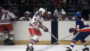 NEW YORK - CIRCA 1979: Don Maloney #12 of the New York Rangers skates against the New York Islanders during an NHL Hockey game circa 1979 at Madison Square Garden in the Manhattan borough of New York City. Maloney's playing career went from 1978-91. (Photo by Focus on Sport/Getty Images)