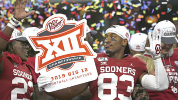 ARLINGTON, TX - DECEMBER 07: (L-R) Todd Hudson #23 of the Oklahoma Sooners and teammate Nick Basquine #83 celebrate the teams 30-23 win over the Baylor Bears following the Big 12 Football Championship at AT&T Stadium on December 7, 2019 in Arlington, Texas. (Photo by Ron Jenkins/Getty Images)