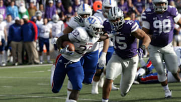 MANHATTAN, KS - NOVEMBER 26: Kansas Jayhawks running back Ke'aun Kinner (22) stiff arms Kansas State Wildcats defensive end Jordan Willis (75) during the NCAA football game between the Kansas Jayhawks and the Kansas State Wildcats on November, 26 2016, at Bill Snyder Family Stadium in Manhattan, KS. The Wildcats won 34-19. (Photo by Sean Sewell/Icon Sportswire via Getty Images)