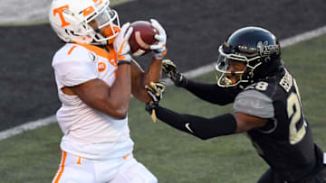 Dec 12, 2020; Nashville, Tennessee, USA; Tennessee Volunteers wide receiver Velus Jones Jr. (1) catches a touchdown as he is defended by Vanderbilt Commodores cornerback Allan George (28) during the first half at Vanderbilt Stadium. Mandatory Credit: Christopher Hanewinckel-USA TODAY Sports