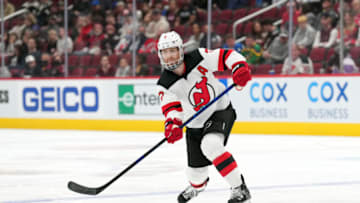 New Jersey Devils defenseman Dougie Hamilton (7) passes the puck against the Arizona Coyotes during the first period at Gila River Arena. Mandatory Credit: Joe Camporeale-USA TODAY Sports