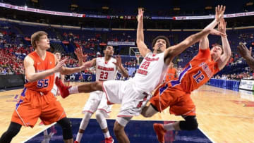 Mar 6, 2015; St. Louis, MO, USA; Illinois State Redbirds center Reggie Lynch (22) and Evansville Aces guard Adam Wing (12) battle for a rebound during the first round of the Missouri Valley Conference Tournament at Scottrade Center. Mandatory Credit: Scott Rovak-USA TODAY Sports