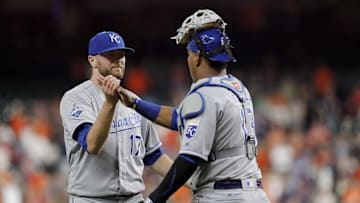 Apr 12, 2016; Houston, TX, USA; Kansas City Royals relief pitcher Wade Davis (17) is congratulated by catcher Salvador Perez (13) after striking out Houston Astros right fielder George Springer (not pictured) with two men on in the bottom of the ninth inning to end the game at Minute Maid Park. Royals won 3 to 2. Mandatory Credit: Thomas B. Shea-USA TODAY Sports