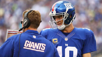 EAST RUTHERFORD, NJ - SEPTEMBER 18: Quarterback Eli Manning #10 of the New York Giants talks with head coach Ben McAdoo against the New Orleans Saints during the second half at MetLife Stadium on September 18, 2016 in East Rutherford, New Jersey. (Photo by Al Bello/Getty Images)