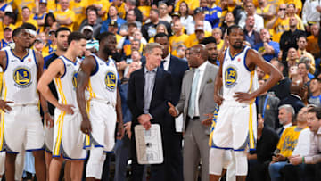OAKLAND, CA - MAY 31: Head coach Steve Kerr and assistant coach Mike Brown of the Golden State Warriors talk in Game One of the 2018 NBA Finals against the Cleveland Cavaliers on May 31, 2018 at ORACLE Arena in Oakland, California. NOTE TO USER: User expressly acknowledges and agrees that, by downloading and or using this photograph, user is consenting to the terms and conditions of Getty Images License Agreement. Mandatory Copyright Notice: Copyright 2018 NBAE (Photo by Andrew D. Bernstein/NBAE via Getty Images)