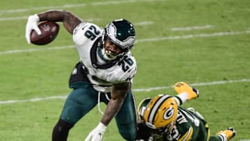 Dec 6, 2020; Green Bay, Wisconsin, USA; Philadelphia Eagles running back Miles Sanders (26) is tackled by Green Bay Packers cornerback Jaire Alexander (23) in the third quarter at Lambeau Field. Mandatory Credit: Benny Sieu-USA TODAY Sports