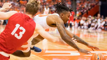 SYRACUSE, NY - NOVEMBER 10: Geno Thorpe #30 of the Syracuse Orange dives on a loose ball during a full court press of Cornell Big Red during the first half at the Carrier Dome on November 10, 2017 in Syracuse, New York. (Photo by Brett Carlsen/Getty Images)
