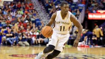Mar 28, 2016; New Orleans, LA, USA; New Orleans Pelicans guard Jrue Holiday (11) drives with the ball against the New York Knicks during the second half of a game at the Smoothie King Center. The Pelicans defeated the Knicks 99-91. Mandatory Credit: Derick E. Hingle-USA TODAY Sports