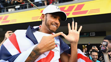 MEXICO CITY, MEXICO - OCTOBER 28: 2018 F1 World Drivers Champion Lewis Hamilton of Great Britain and Mercedes GP celebrates with his team after the Formula One Grand Prix of Mexico at Autodromo Hermanos Rodriguez on October 28, 2018 in Mexico City, Mexico. (Photo by Clive Mason/Getty Images)