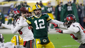 Green Bay Packers quarterback Aaron Rodgers (12) throws an inccomplete pass against Tampa Bay Buccaneers defensive end Ndamukong Suh (93) in the final minutes of the game during the NFC championship game Sunday, January 24, 2021, at Lambeau Field in Green Bay, Wis. Dan Powers/USA TODAY NETWORK-WisconsinApc Packvstampa 0124211541djpb