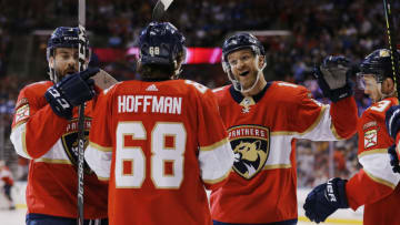 SUNRISE, FLORIDA - JANUARY 12: Jonathan Huberdeau #11 of the Florida Panthers celebrates with teammates after assisting a goal which made him the the all-time Florida Panthers leader in points during the third period against the Toronto Maple Leafs at BB&T Center on January 12, 2020 in Sunrise, Florida. (Photo by Michael Reaves/Getty Images)