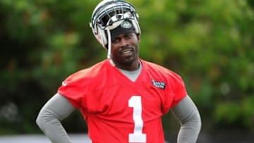 Jul 24, 2014; Cortland, NY, USA; New York Jets quarterback Michael Vick (1) looks on during training camp at SUNY Cortland. Mandatory Credit: Rich Barnes-USA TODAY Sports