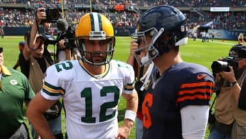 Sep 13, 2015; Chicago, IL, USA; Green Bay Packers quarterback Aaron Rodgers (12) and Chicago Bears quarterback Jay Cutler (6) meet at midfield following the second half at Soldier Field. Green Bay won 31-23. Mandatory Credit: Dennis Wierzbicki-USA TODAY Sports