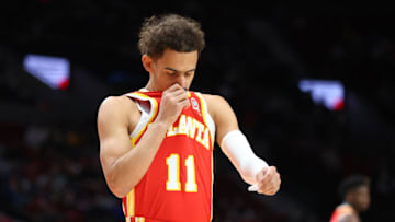 PORTLAND, OREGON - JANUARY 03: Trae Young #11 of the Atlanta Hawks reacts against the Portland Trail Blazers during the first half at Moda Center on January 03, 2022 in Portland, Oregon. NOTE TO USER: User expressly acknowledges and agrees that, by downloading and or using this photograph, User is consenting to the terms and conditions of the Getty Images License Agreement. (Photo by Abbie Parr/Getty Images)