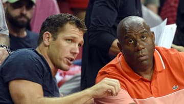 LAS VEGAS, NV - JULY 16: Head coach Luke Walton (L) of the Los Angeles Lakers and Lakers president of basketball operations Earvin 'Magic' Johnson talk courtside during the team's semifinal game of the 2017 Summer League against the Dallas Mavericks at the Thomas