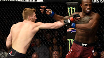 LAS VEGAS, NV - DECEMBER 30: (L-R) Dan Hooker of New Zealand punches Marc Diakiese of Congo in their lightweight bout during the UFC 219 event inside T-Mobile Arena on December 30, 2017 in Las Vegas, Nevada. (Photo by Jeff Bottari/Zuffa LLC/Zuffa LLC via Getty Images)