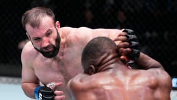 LAS VEGAS, NEVADA - MARCH 12: (L-) Azamat Murzakanov of Russia punches Tafon Nchukwi of Cameroon in their light heavyweight fight during the UFC Fight Night event at UFC APEX on March 12, 2022 in Las Vegas, Nevada. (Photo by Chris Unger/Zuffa LLC)