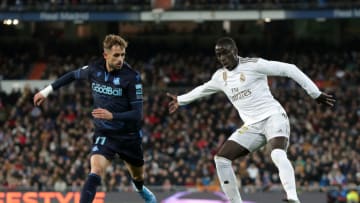 MADRID, SPAIN - NOVEMBER 23: Adnan Januzaj of Real Sociedad battles for possession with Ferland Mendy of Real Madrid during the La Liga match between Real Madrid CF and Real Sociedad at Estadio Santiago Bernabeu on November 23, 2019 in Madrid, Spain. (Photo by Gonzalo Arroyo Moreno/Getty Images)