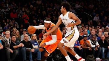 Dec 1, 2013; New York, NY, USA; New York Knicks small forward Carmelo Anthony (7) drives past New Orleans Pelicans small forward Josh Childress (8) during the second quarter at Madison Square Garden. New Orleans Pelicans won 103-99. Mandatory Credit: Anthony Gruppuso-USA TODAY Sports