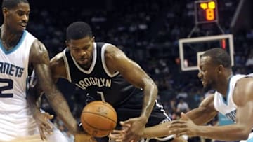 Nov 18, 2015; Charlotte, NC, USA; Brooklyn Nets guard forward Joe Johnson (7) along with Charlotte Hornets forward Marvin Williams (2) and guard Kemba Walker (15) go after a loose ball during the second half of the game at Time Warner Cable Arena. Hornets win 116-111. Mandatory Credit: Sam Sharpe-USA TODAY Sports