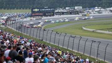 Aug 3, 2014; Long Pond, PA, USA; General view as NASCAR Sprint Cup Series drivers come around turn three to start the GoBowling.com 400 at Pocono Raceway. Mandatory Credit: Bill Streicher-USA TODAY Sports