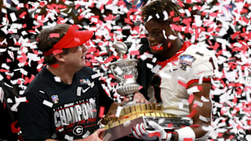 NEW ORLEANS, LOUISIANA - JANUARY 01: George Pickens #1 of the Georgia Bulldogs and head coach Kirby Smart of the Georgia Bulldogs hold the Allstate Sugar Bowl trophy after defeating the Baylor Bears 26-14 at Mercedes Benz Superdome on January 01, 2020 in New Orleans, Louisiana. (Photo by Sean Gardner/Getty Images)