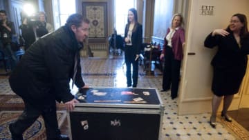 UNITED STATES – FEBRUARY 29: Lord Stanley's Cup is wheeled into the Senate Foreign Relations Committee room in the U.S. Capitol for a photo-op with the Massachusetts delegation on Wednesday, Feb. 29, 2012. The Boston Bruins won the Stanley Cup in 2011. (Photo By Bill Clark/CQ Roll Call)