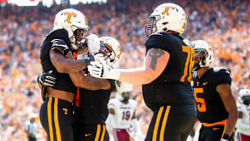 Teammates swarm Tennessee running back Tiyon Evans (8) after Evans scored a touchdown during a NCAA football game between the Tennessee Volunteers and the South Carolina Gamecocks at Neyland Stadium in Knoxville, Tenn. on Saturday, Oct. 9, 2021.Kns Tennessee South Carolina Football Bp