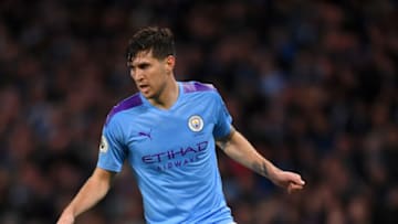 MANCHESTER, ENGLAND - NOVEMBER 23: John Stones of Manchester City runs with the ball during the Premier League match between Manchester City and Chelsea FC at Etihad Stadium on November 23, 2019 in Manchester, United Kingdom. (Photo by Laurence Griffiths/Getty Images)