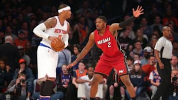 Feb 28, 2016; New York, NY, USA; New York Knicks small forward Carmelo Anthony (7) controls the ball against Miami Heat small forward Joe Johnson (2) during the first quarter at Madison Square Garden. Mandatory Credit: Brad Penner-USA TODAY Sports