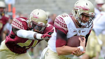 Apr 11, 2015; Tallahassee, FL, USA; Florida State Seminoles quarterback J.J. Cosentino (16) runs the ball as he is chased down by defensive end Lorenzo Featherston (41) during the spring game at Doak Campbell Stadium. Mandatory Credit: Melina Vastola-USA TODAY Sports