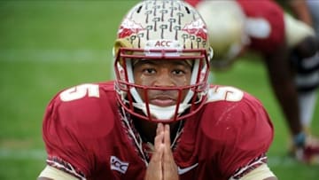 Nov 16, 2013; Tallahassee, FL, USA; Florida State Seminoles quarterback Jameis Winston (5) warms up before the start of the game against the Syracuse Orange at Doak Campbell Stadium. Mandatory Credit: Melina Vastola-USA TODAY Sports