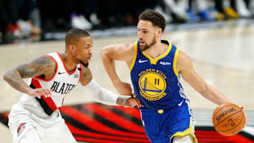 PORTLAND, OREGON - MAY 18: Klay Thompson #11 of the Golden State Warriors handles the ball against Damian Lillard #0 of the Portland Trail Blazers during the second half in game three of the NBA Western Conference Finals at Moda Center on May 18, 2019 in Portland, Oregon. NOTE TO USER: User expressly acknowledges and agrees that, by downloading and or using this photograph, User is consenting to the terms and conditions of the Getty Images License Agreement. (Photo by Jonathan Ferrey/Getty Images)