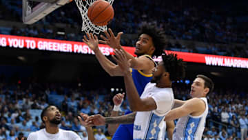 CHAPEL HILL, NORTH CAROLINA - JANUARY 08: Justin Champagnie #11 of the Pittsburgh Panthers battles Leaky Black #1 of the North Carolina Tar Heels for a rebound during the first half of their game at Dean Smith Center on January 08, 2020 in Chapel Hill, North Carolina. (Photo by Grant Halverson/Getty Images)