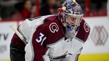 RALEIGH, NC - OCTOBER 20: Phillipp Grubauer #31 of the Colorado Avalanche crouches in the crease prior to a faceoff during an NHL game against the Carolina Hurricanes on October 20, 2018 at PNC Arena in Raleigh, North Carolina. (Photo by Gregg Forwerck/NHLI via Getty Images)