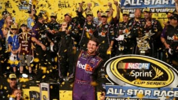 May 16, 2015; Concord, NC, USA; NASCAR Sprint Cup Series driver Denny Hamlin (11) celebrates after winning the Sprint All-Star Race at Charlotte Motor Speedway. Mandatory Credit: Randy Sartin-USA TODAY Sports