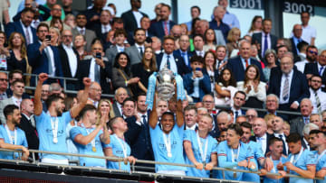 LONDON, ENGLAND - JUNE 3: Manuel Akanji of Manchester City lifts the trophy after the Emirates FA Cup Final between Manchester City and Manchester United at Wembley Stadium on June 3, 2023 in London, England. (Photo by Craig Mercer/MB Media/Getty Images)