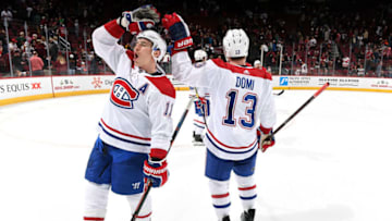 GLENDALE, AZ - DECEMBER 20: Brendan Gallagher #11 and Max Domi #13 of the Montreal Canadiens celebrate after a 2-1 victory against the Arizona Coyotes at Gila River Arena on December 20, 2018 in Glendale, Arizona. (Photo by Norm Hall/NHLI via Getty Images)