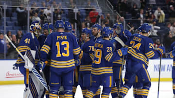 Oct 19, 2021; Buffalo, New York, USA; The Buffalo Sabres celebrate a win over the Vancouver Canucks at KeyBank Center. Mandatory Credit: Timothy T. Ludwig-USA TODAY Sports