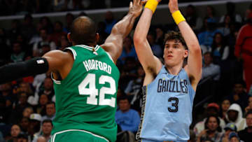 Nov 7, 2022; Memphis, Tennessee, USA; Memphis Grizzlies forward Jake LaRavia (3) shoots for three during the first half against the Boston Celtics at FedExForum. Mandatory Credit: Petre Thomas-USA TODAY Sports