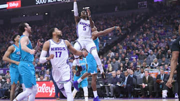 SACRAMENTO, CA - JANUARY 02: De'Aaron Fox #5 of the Sacramento Kings drives to the basket past Dwight Howard #12 of the Charlotte Hornets during an NBA basketball game at Golden 1 Center on January 2, 2018 in Sacramento, California. NOTE TO USER: User expressly acknowledges and agrees that, by downloading and or using this photograph, User is consenting to the terms and conditions of the Getty Images License Agreement. (Photo by Thearon W. Henderson/Getty Images)