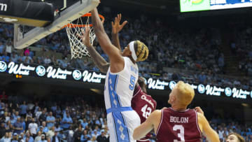 Nov 11, 2022; Chapel Hill, North Carolina, USA; North Carolina Tar Heels forward Armando Bacot (5) goes to the basket against Charleston Cougars forward Charles Lampten (42) during the second half at Dean E. Smith Center. Mandatory Credit: James Guillory-USA TODAY Sports
