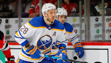 NEWARK, NEW JERSEY - OCTOBER 23: Zemgus Girgensons #28 of the Buffalo Sabres in action against the New Jersey Devils at Prudential Center on October 23, 2021 in Newark, New Jersey. The Devils defeated the Sabres 2-1 in overtime. (Photo by Jim McIsaac/Getty Images)