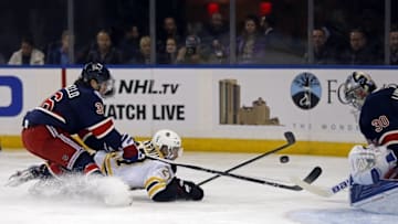 Oct 26, 2016; New York, NY, USA; Boston Bruins center Austin Czarnik (27) battles for the puck with New York Rangers right wing Mats Zuccarello (36) and Rangers goalie Henrik Lundqvist (30) during the first period at Madison Square Garden. Mandatory Credit: Adam Hunger-USA TODAY Sports